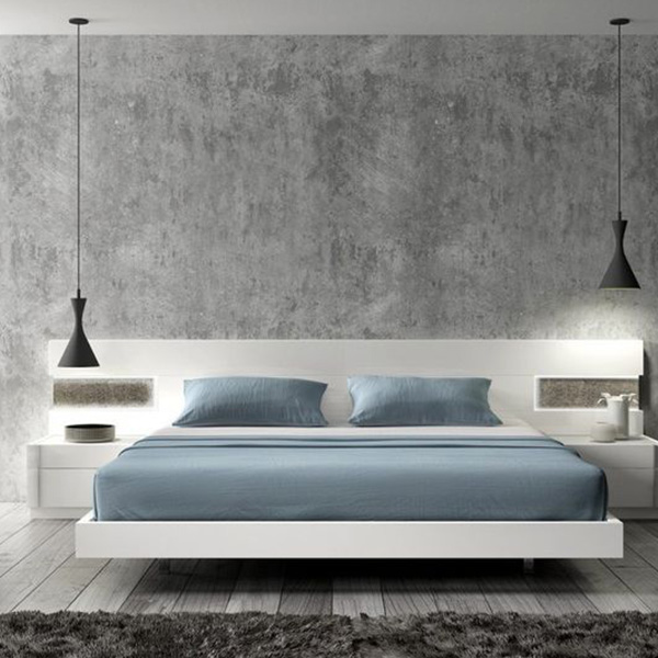 A bedroom wall finished using concrete finishes