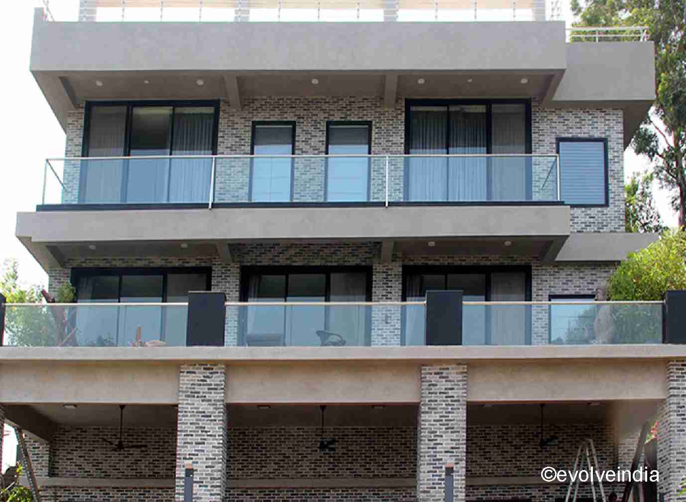 Exterior Design Exterior Wall Texture Design of A Residential Space done by Evolve India using decorative concrete finishes