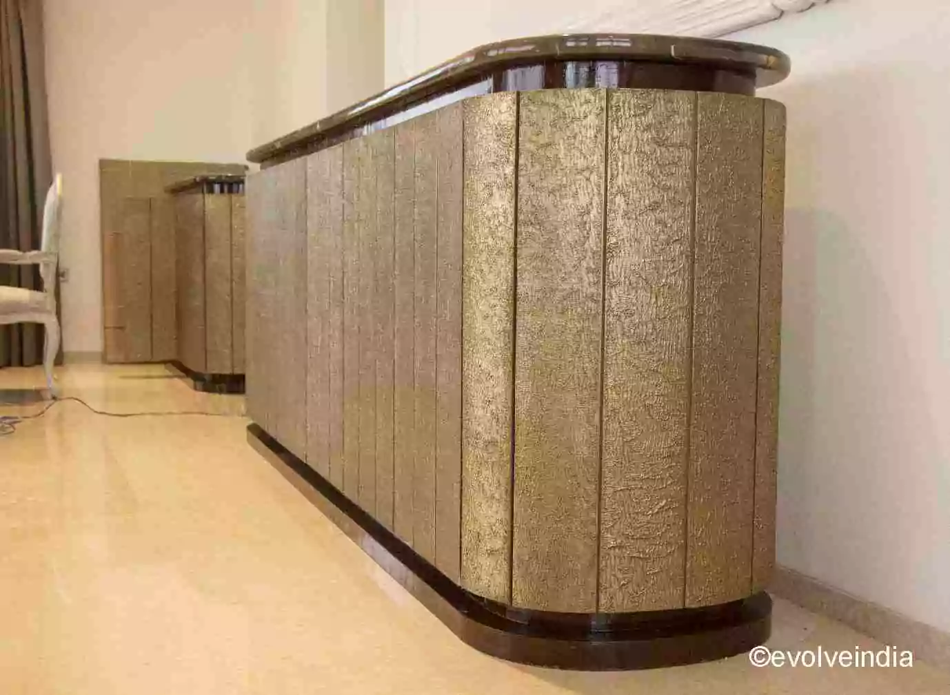 Bar table designed using brass finish by Evolve India