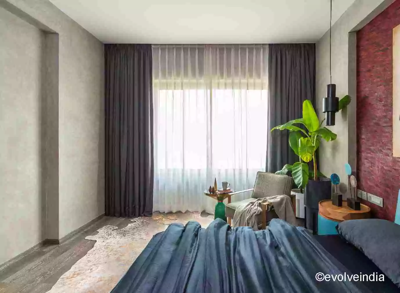 Seamless wall designed using textured concrete finish by Evolve India
