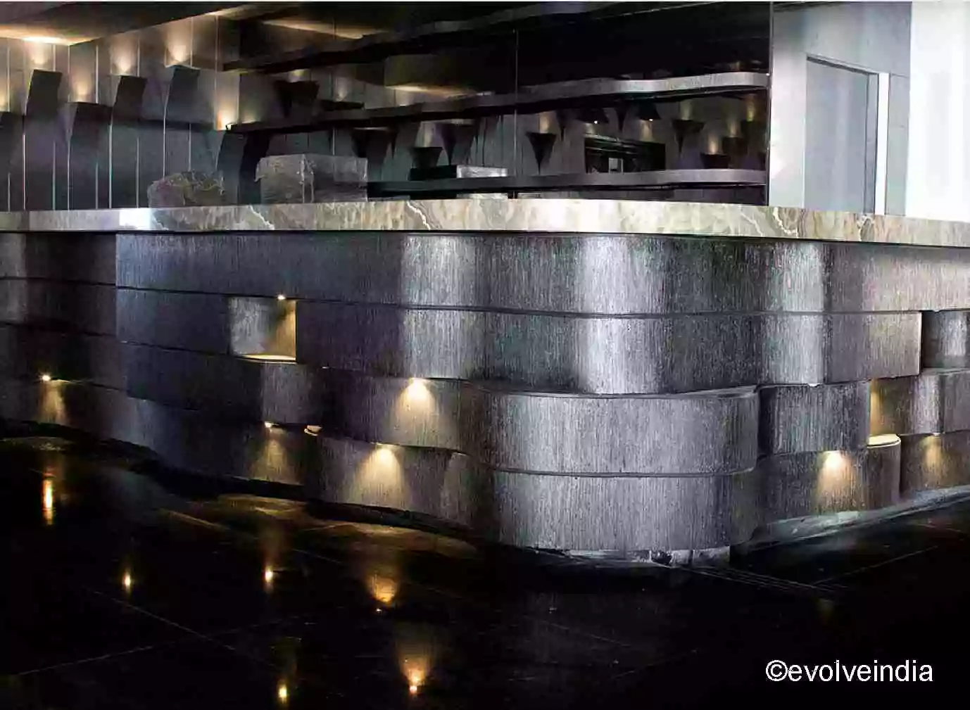 Bar table designed by Evolve India using ink drip gunmetal finish
