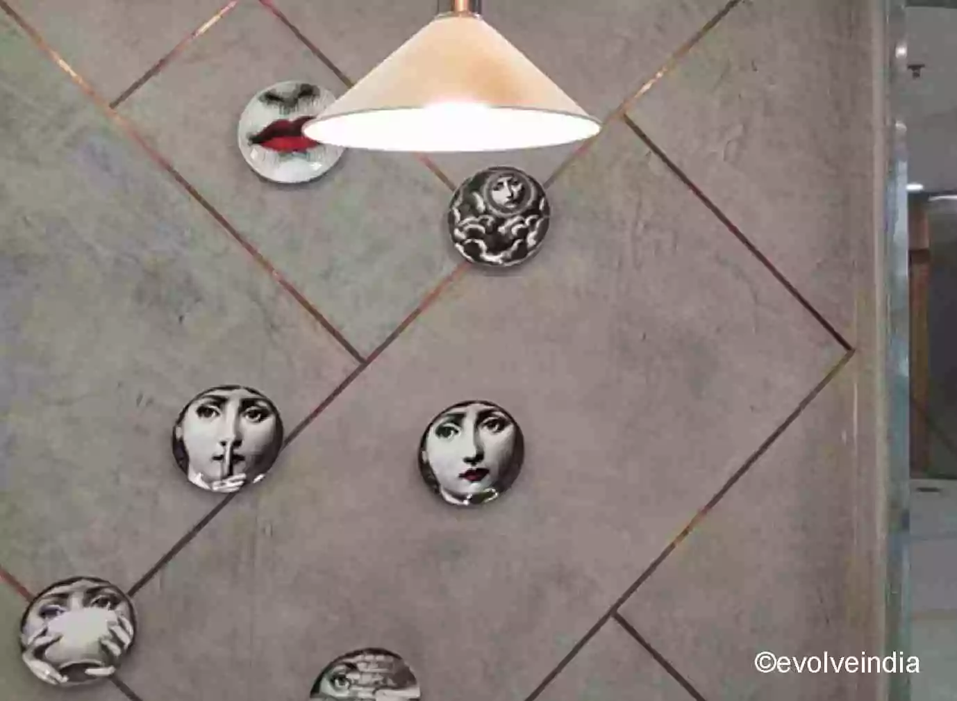 Seamless wall designed using decorative concrete finish with liquid metal copper inlays