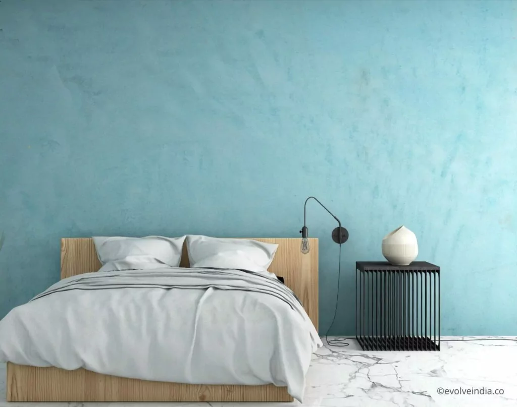 Modern bedroom bed back wall design with decorative concrete finish by Evolve India