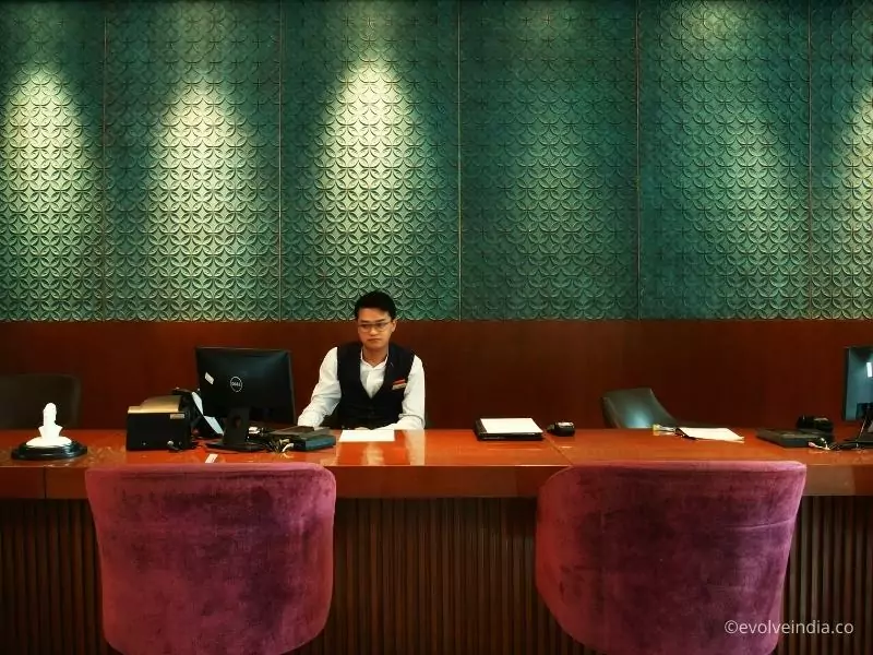 Reception wall designed using verdigris green copper patina wall panels